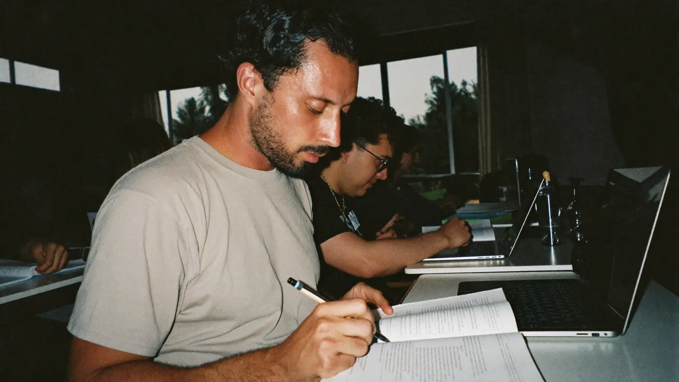 An adult learner studying in an evening class