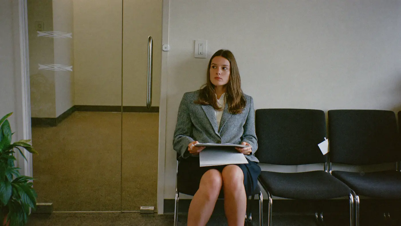 A candidate waiting in an office reception before an interview